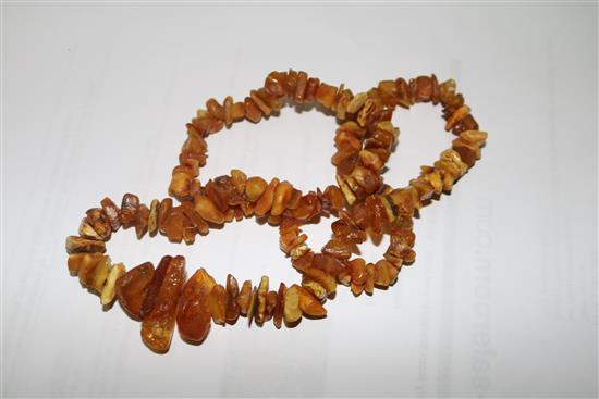 Three assorted amber necklaces, gross weight 108 grams.